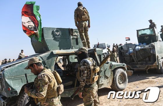 21일 모술 남부에서 중심지로 진격하는 이라크정부군 © AFP=뉴스1
