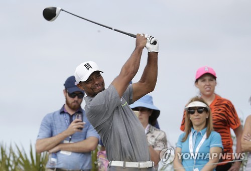 Tiger Woods tees off on the fourth hole during the third round at the Hero World Challenge golf tournament, Saturday, Dec. 3, 2016, in Nassau, Bahamas. (AP Photo/Lynne Sladky)