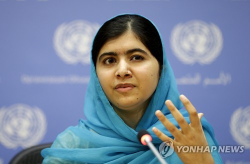 epa05902502  (FILE) - A file photograh showing Malala Yousafzai speaking at a press conference on  the sidelines of the United Nations Sustainable Development Summit before the start of the 70th session General Debate of the United Nations General Assembly at United Nations headquarters in New York, New York, USA, 25 September 2015. Media reports on 11 April 2017 state that Malala Yousafzai been given the highest honor by the UN. The Nobel Peace Prize winner is now the youngest Messenger of Peace.  EPA/ANDREW GOMBERT *** Local Caption *** 53383389