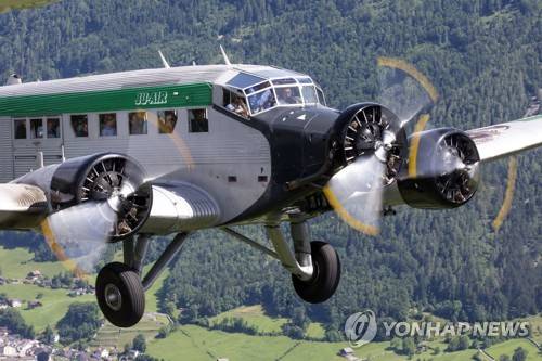 SWITZERLAND ACCIDENTS FLIMS PLANE CRASH epa06928809 A handout photo dated 22 June 2015 and made available by Swiss JU-AIR on 05 August 2018 showing a historic JU-52 aircraft of the JU-AIR in the air. A JU-52 of the JU-AIR crashed on 05 August 2018 at Piz Segnas above Flims, Switzerland, on its way from Locarno to Duebendorf. Authorities say all 20 people on-board died.  EPA/SUSANNE VENDITTI JU-AIR HANDOUT MANDATORY CREDIT: SUSANNE VENDITTI JU-AIR, HANDOUT EDITORIAL USE ONLY/NO SALES