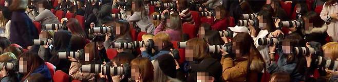 아이돌을 따라다니는 10~20대 팬들에게 ‘대포 카메라’는 필수품이다. 덕분에 어린 여성들이 카메라 시장의 큰손으로 떠오르고, 비싼 망원렌즈를 대여해주는 카메라 렌털숍에 손님이 몰린다. /브이라이브