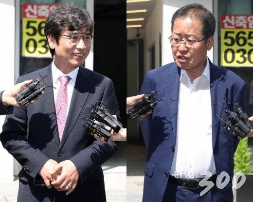 &nbsp;유시민 노무현재단 이사장(왼쪽)과 홍준표 자유한국당 전 대표가 3일 오전 서울 강남구 한 스튜디오에서 열리는 유튜브 맞짱토론 '홍카레오'에 참석하며 취재진 질문에 답하고 있다.  '홍카레오'는 두 사람의 유튜브 계정 '유시민의 알릴레오'와 'TV홍카콜라'를 조합해서 정해졌으며 3일 오후 10시 유튜브를 통해 공개된다./사진=이기범 기자