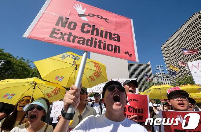 9일(현지시간) '범죄인 인도 법안' 반대 집회에 참여한 홍콩 시민들. 이날 시위에 참여한 시민은 약 100만명에 이른다. 2019.06.09.© AFP=뉴스1