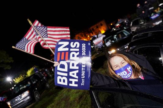 Supporters of U.S. Democratic presidential candidate Joe Biden and vice presidential nominee Kamala Harris take part in a drive-in campaign rally in Philadelphia, Pennsylvania, U.S., November 1, 2020. REUTERS