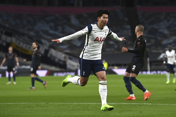 Tottenham Hotspurs' Son Heung-min celebrates after scoring the opener during Spurs' Premier League match against Manchester City at Tottenham Hotspur Stadium on Saturday. [AP]