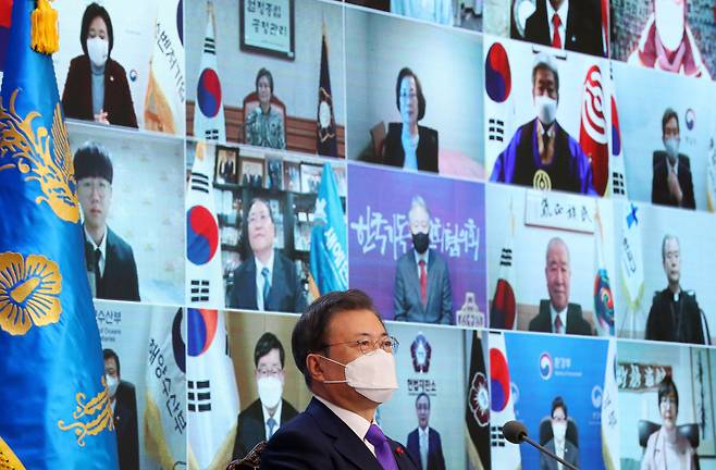 President Moon Jae-in speaks during a virtual meeting with 50 representatives from political and business communities as well as members of the public at Cheong Wa Dae in Seoul on Thursday. (Yonhap)