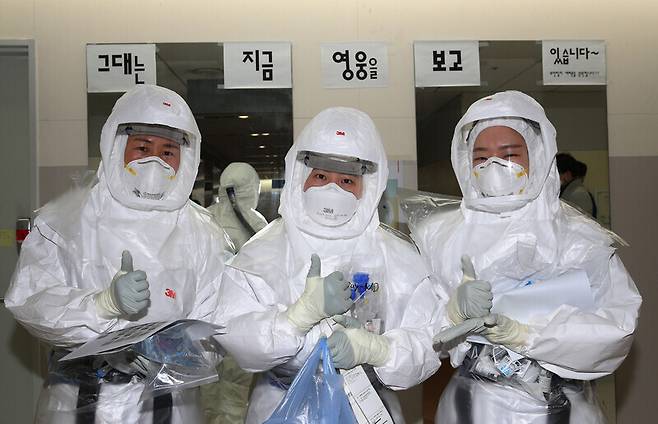 Nurses dressed in protective gear on their way to care for COVID-19 patients.