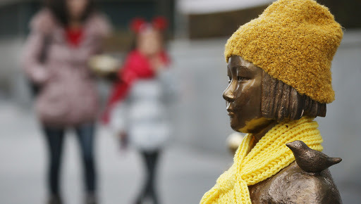 A statue of a girl symbolizing "comfort women" in front of the Japanese embassy in Seoul. (Yonhap)