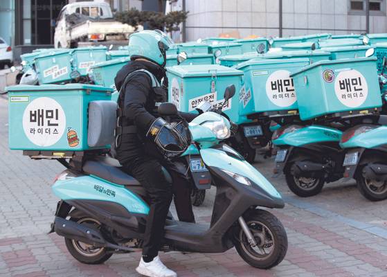 Food delivery motorcycles of Baedal Minjok, also known as Baemin, are parked in the company's rider center in southern Seoul. [NEWS1]
