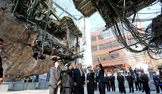 U.S. and South Korean military officials visit the wreck of the Cheonan in 2015. [JOINT PRESS POOL]