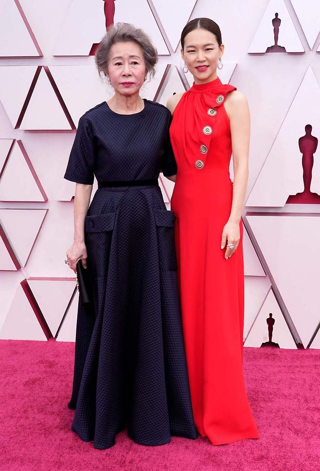 Youn Yuh-Jung (left) and Han Ye-ri arrive at the Oscars at Union Station in Los Angeles on Sunday. (AFP)