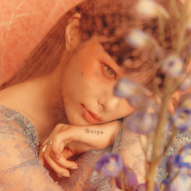 A new EP album cover Image from singer-songwriter Heize has been released.P NATION released album covers and Teaser Images of Heizes seventh EP HAPPEN sequentially on its official SNS on May 16.Inside the album cover, Heizes deep-eyed close-up shot is impressive.Heizes dreamy visuals, which blend with the brilliant sunshine, raise questions about the new concept.In addition, the Teaser Image, which was unveiled on the same day, featured Heize, wearing a dress with feathers added to the background of the red sky, and radiating a mysterious Aura.Heize overwhelms the gaze, creating a city-wide, sophisticated mood from various angles.In the previously released Teaser, Heize also attracted attention with his appearance beyond the glass with the droplets, and his colorful and lonely atmosphere surrounded by colorful flowers.HAPPEN, which melts various feelings and stories about love, is a new album released by Heize in about 11 months and is the first album released after joining Pine, who is headed by Psy last year.Producers Yu Gun-hyung, Tablo, Giri Boy, GLEAM, Han Yo-han, and featuring artists such as Gary, Changmo, Kim Pil and Ahn Ye-eun make the album look forward to high perfection.