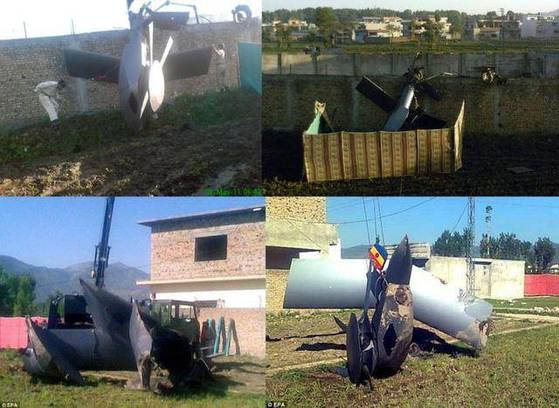 파키스탄 당국은 미 스텔스 헬기의 잔해를 가림막으로 가렸다.〈사진=금일중국 캡처〉