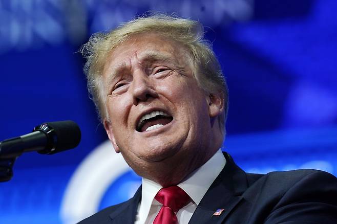 FILE - In this Saturday, July 24, 2021, file photo former President Donald Trump speaks on a variety of topics to supporters at a Turning Point Action gathering in Phoenix.  Trump urged senior Justice Department officials to declare the 2020 election results “corrupt” in a December phone call. That's according to handwritten notes from one of the participants in the conversation. The notes of the Dec. 27 call were released Friday by the Democratic-led House Oversight Committee.  (AP Photo/Ross D. Franklin, File)