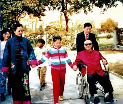 File photo of Xi Jinping (R, rear) with his father Xi Zhongxun (R, front), his wife Peng Liyuan (L, front) and his daughter (C, front). (PRNewsfoto/CCTV+)