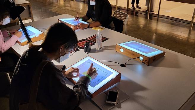 Participants’ work at DIY webtoon drawing events, to be collected to make one final piece after the book fair. (Kim Hae-yeon/The Korea Herald)