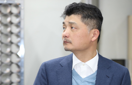 Kakao founder and chairman Kim Beom-su in Seoul in March 2019. Kim is again reportedly accused of omitting information of a de facto holdings company which he entirely owns and control Kakao from. [YONHAP]