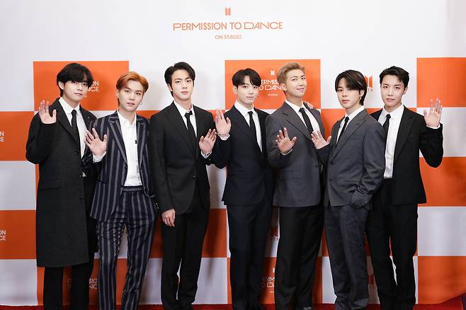 Members of K-pop sensation BTS pose for photos during a press conference for the “Permission to Dance on Stage” concert series at SoFi Stadium in Los Angeles on Sunday. (Big Hit Music)