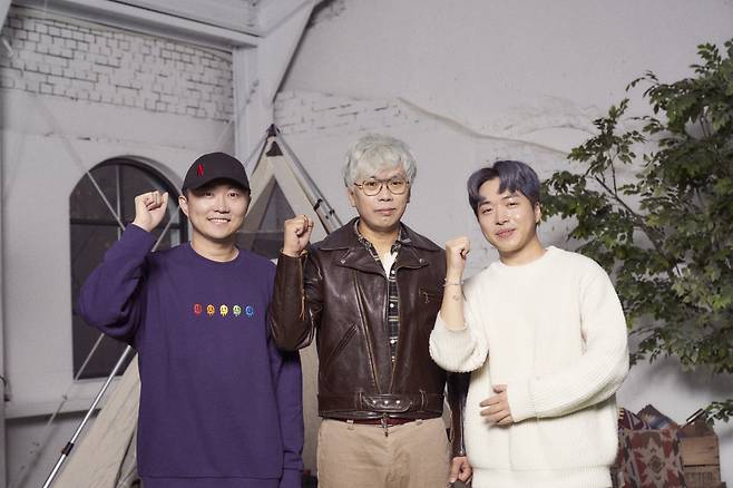 From left: Directors Chang Woo-sung, Kim Tae-ho and Lee Joo-won pose for photos after an online press conference Wednesday. (Netflix)