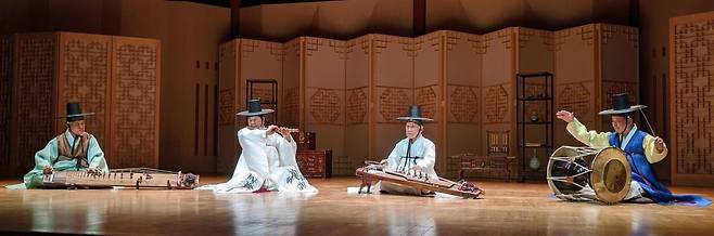 A quartet of traditional Korean musical instruments (from left) Geomungo player Kim Mu-gil, Daegeum player Won Jang-hyun, Ajaeng player Kim Il-gu and Janggo player Kim Cheong-man, perform at the National Gugak Center in Seoul.  Photo © Hyungwon Kang