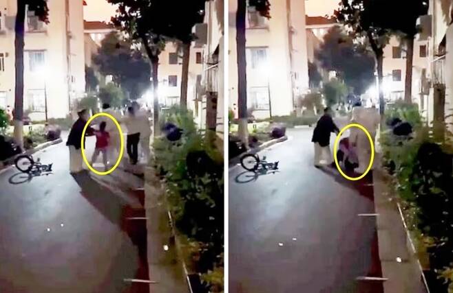 방역 요원에게 강제로 끌려가는 어머니를 붙잡으려 애쓰는 중국 상하이의 어린 소년