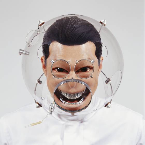 “Altering Facial Features with H-WR” (2007) by Lee accentuates his eyes and wide smile with convex lenses. [BUSAN MUSEUM OF ART]