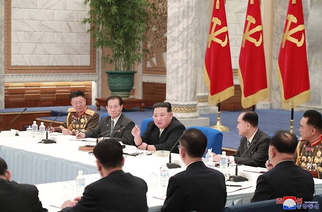 North Korean leader Kim Jong-un (center) speaks during a meeting of the Central Military Commission of the Workers‘ Party of Korea on Tuesday in this photo provided by the state-run Korean Central News Agency. (Yonhap)