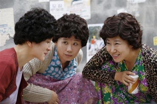 This still cut shows a scene from the 2015 TV series "Reply 1988" featuring three "ajumma" characters. (tvN)