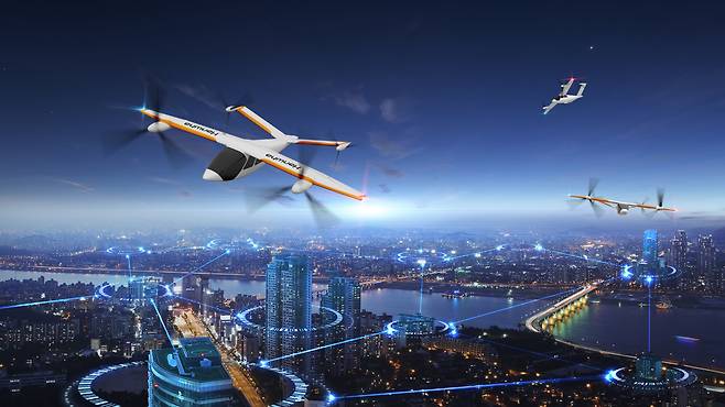 한화시스템이 개발 중인 에어택시 ‘버터플라이’가 서울 시내 상공을 운항하는 모습. [한화시스템 제공]