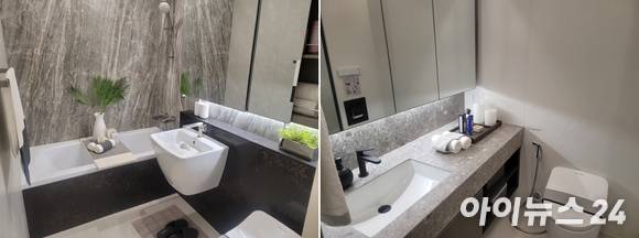 '인시그니아 반포' 전용 84㎡C 거실과 안방 화장실. [사진=김서온 기자]