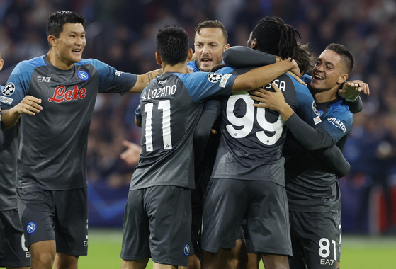 Napoli players celebrate after Giacomo Raspadori scores their fourth goal in a Champions League game against Ajax in Amsterdam on Tuesday.  [REUTERS/YONHAP]
