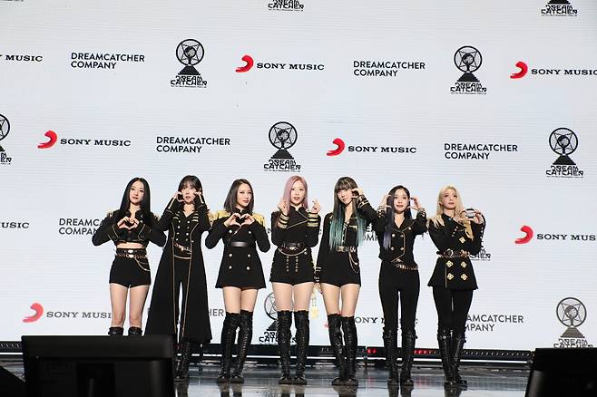 K-pop girl group Dreamcatcher poses for photos during a press showcase event for its seventh EP “Apocalypse: Follow Us,” held at Konkuk University in Seoul, Tuesday. (Dreamcatcher Company)