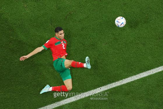 DOHA, QATAR - DECEMBER 10: Achraf Hakimi of Morocco looks on during the FIFA World Cup Qatar 2022 quarter final match between Morocco and Portugal at Al Thumama Stadium on December 10, 2022 in Doha, Qatar. (Photo by Lars Baron/Getty Images)