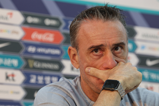 Paulo Bento listens to a reporter's question during a press briefing at a training center in Doha, Qatar, on Nov. 29, 2022. [NEWS1]