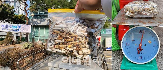 지난달 23일 서울 용산구 한 주민센터에 ‘담배꽁초 수거 보상제’ 참여를 위해 직접 수거한 담배꽁초를 가져가 계량하고 있는 모습.(사진=김범준 기자)