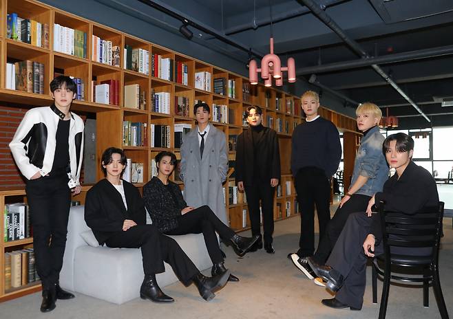 The members of Ateez pose for pictures during an interview in Seoul on Wednesday. (KQ Entertainment)