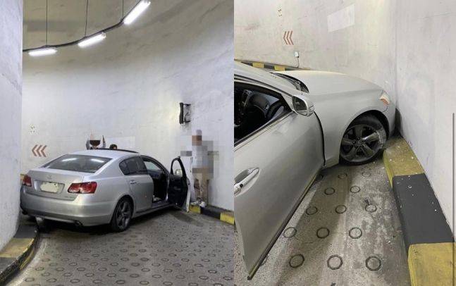 지난 24일 서울의 한 마트 주차장 출구에서 발생한 사고. 이 사고로 뒤따르던 차량들이 약 40분간 주차장에 갇혔다./온라인 커뮤니티