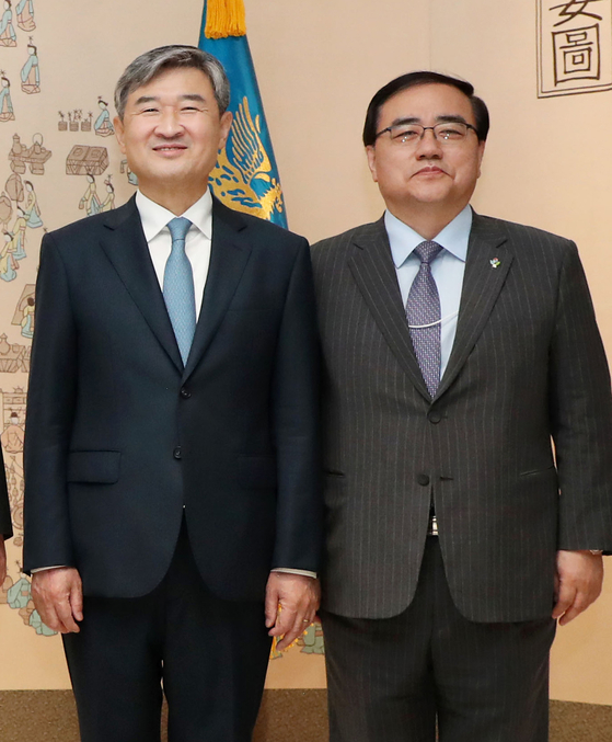 Then-Korean Ambassador to the United States Cho Tae-yong, left, poses for a photo with then-National Security Adviser Kim Sung-han at the Yongsan presidential office in central Seoul in June 2022. Cho was named as the new national security adviser Wednesday after Kim Sung tendered his resignation earlier that day. [YONHAP]