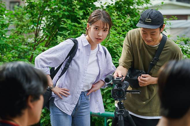 IU stars as So-min, a documentary producer, in “Dream.” (Plus M Entertainment)