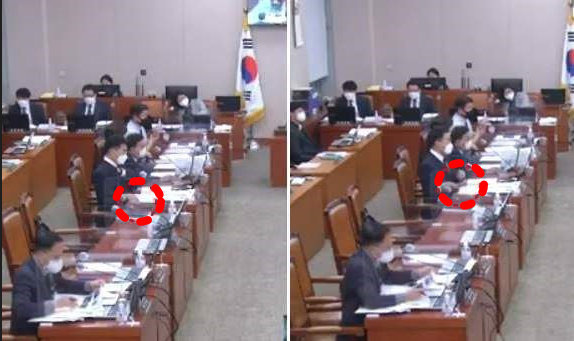 김남국 더불어민주당 의원이 한동훈 법무부장관의 답변이 끝나자 책상 위에 올려뒀던 휴대전화를 집어 들고 있다. 국회방송