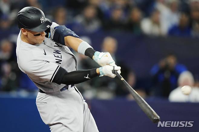 New York Yankees' Aaron Judge hits a two-run home run against the Toronto Blue Jays during the first inning of a baseball game Thursday, May 18, 2023, in Toronto. (Frank Gunn/The Canadian Press via AP)