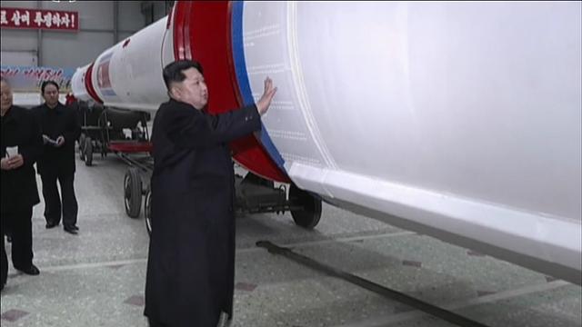 북한 조선중앙TV가 2016년 2월 공개한 기록영화의 한 장면. 김정은 당시 북한 국방위원회 제1위원장이 인공위성을 탑재한 로켓이라고 주장한 '광명성호'를 쓰다듬고 있다. 조선중앙TV 연합뉴스
