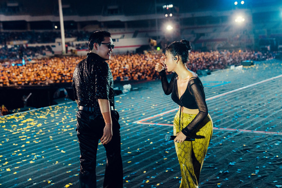 Singers Psy and Hwasa at the ″Summer Swag″ Seoul concert held on Friday at the Jamsil Olympic Main Stadium, southern Seoul [P NATION]