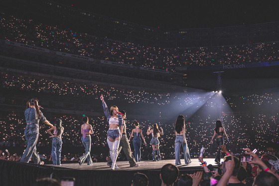 Girl group Twice performs at the Meadowlands Sports Complex's MetLife Stadium near New York on Friday, local time, a first for a K-pop girl group. The performance was held as a part of the group's fifth and ongoing world tour series ″Ready To Be.″ [JYP ENTERTAINMENT]