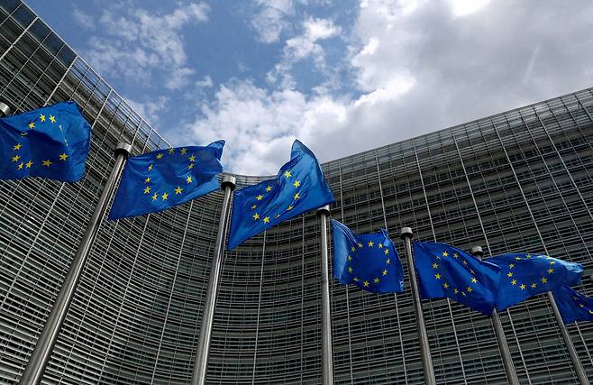 FILE PHOTO: European Union flags flutter outside the European Commission headquarters in Brussels, Belgium, June 5, 2020. REUTERS/Yves Herman//File Photo