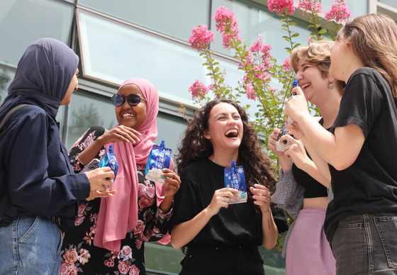 Foreign students at Keimyung University in Daegu savor a Korean ice cream on July 11 in celebration of this year's Chobok — the first day of the hottest season according to the traditional Korean calendar. [NEWS1]