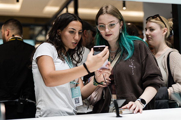 Visitors experience the Galaxy Z Flip 5 at the Galaxy Experience Space in Berlin, Germany, on Aug. 9. (local). [Courtesy of Samsung Electronics]