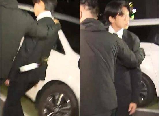 법원이 구속 영장을 기각하자 유아인이 지난 5월 24일 밤 서울 마포경찰서를 나서다 한 시민이 던진 커피병을 맞고 뒤를 돌아보고 있다. SBS 캡처