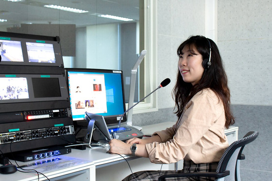 An interpreter for Coupang is working at the company's office. [COUPANG]