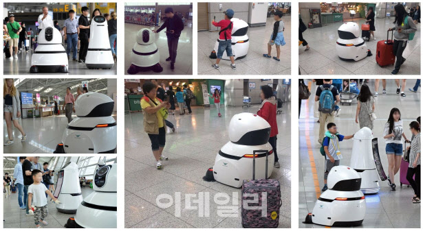 ‘LG 클로이’ 로봇 제품이 시민들과 함께하는 모습.(사진=LG전자)